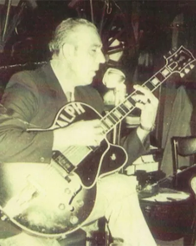 ralph-sr-playing-guitar ralph-sr-playing-guitar